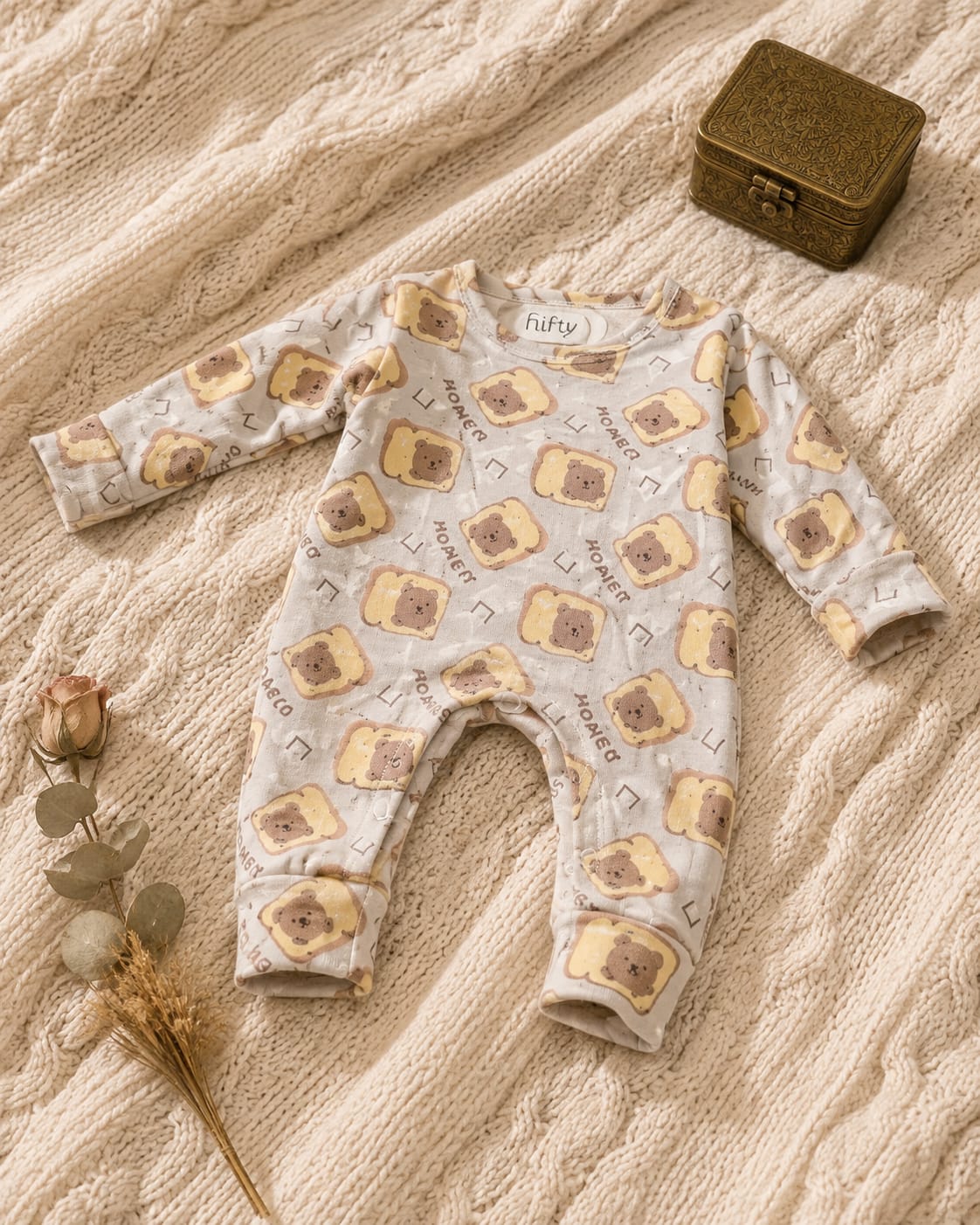 Cream baby romper with bear toast print