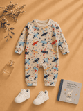 Beige baby romper with airplane print