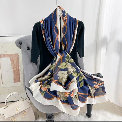 Royal navy silk-satin scarf with large white peony floral print, gold chain link design, and ivory border