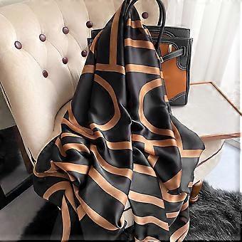 Black silk-satin scarf featuring a bold bronze abstract geometric curved line pattern