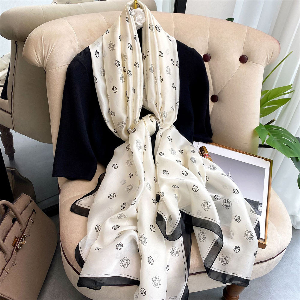 Ivory silk-satin scarf with black camellia flower line-art print and black bordered edge