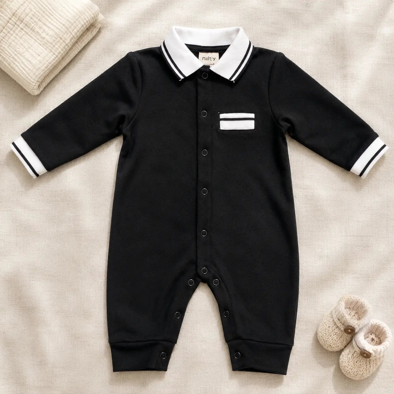 Black baby romper with white striped collar