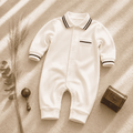 White baby romper with navy striped collar