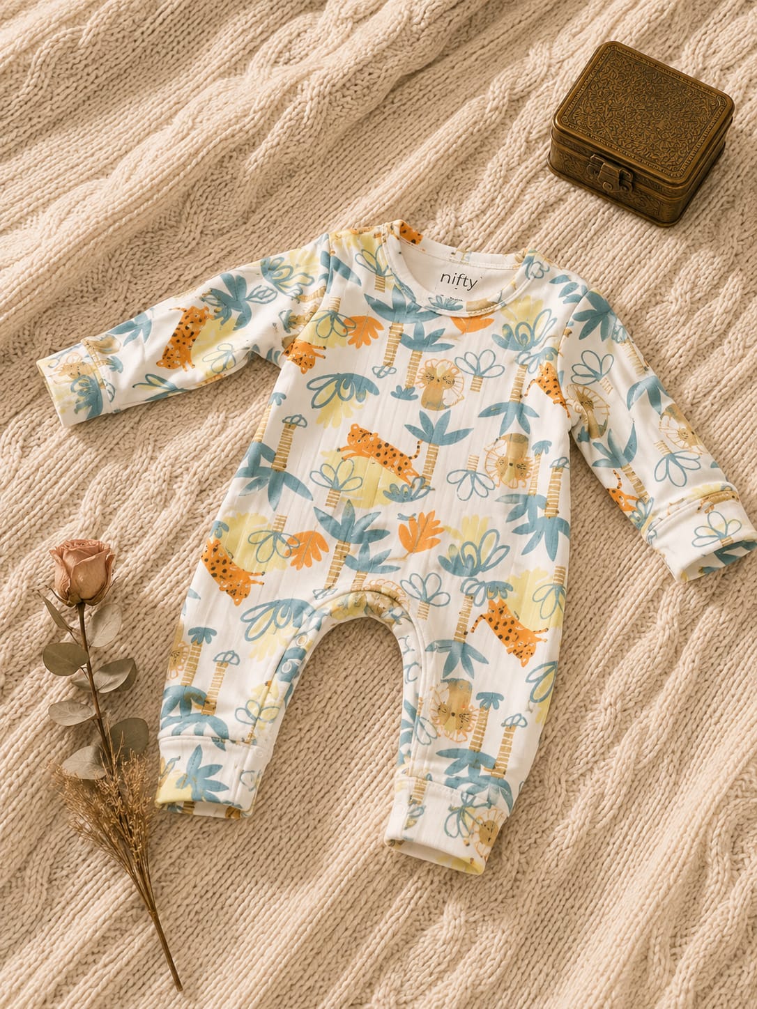 Cream baby romper with jungle animal print