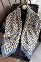 Slate blue and cream silk-satin scarf featuring a repeating interlocking Greek key geometric pattern
