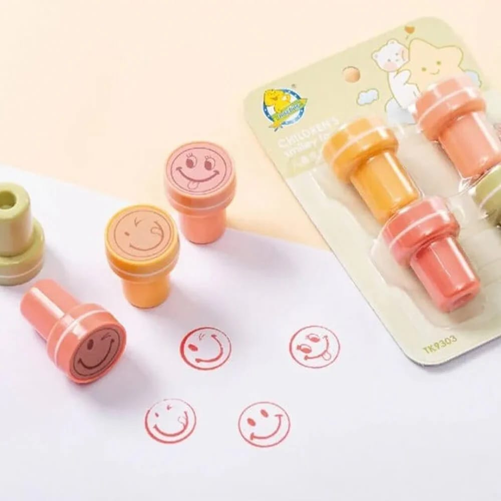 Set of colorful smiley face self-inking stampers for kids' crafts and school rewards.