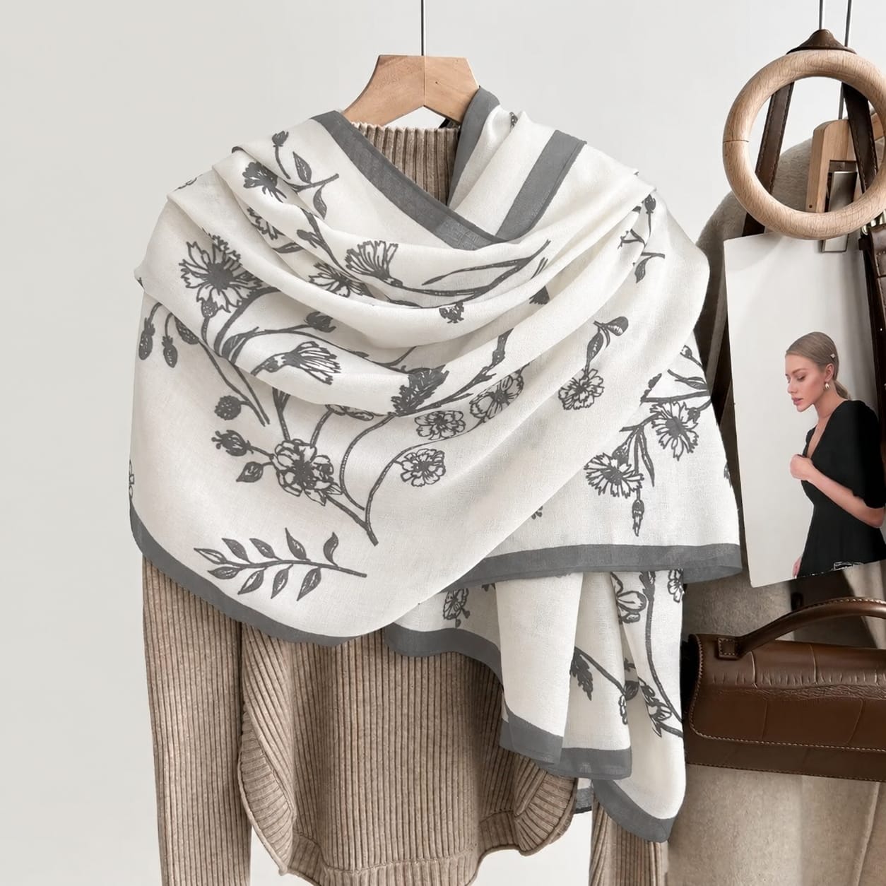 White silk-satin scarf featuring a delicate grey botanical floral line-art pattern and a dark grey bordered edge