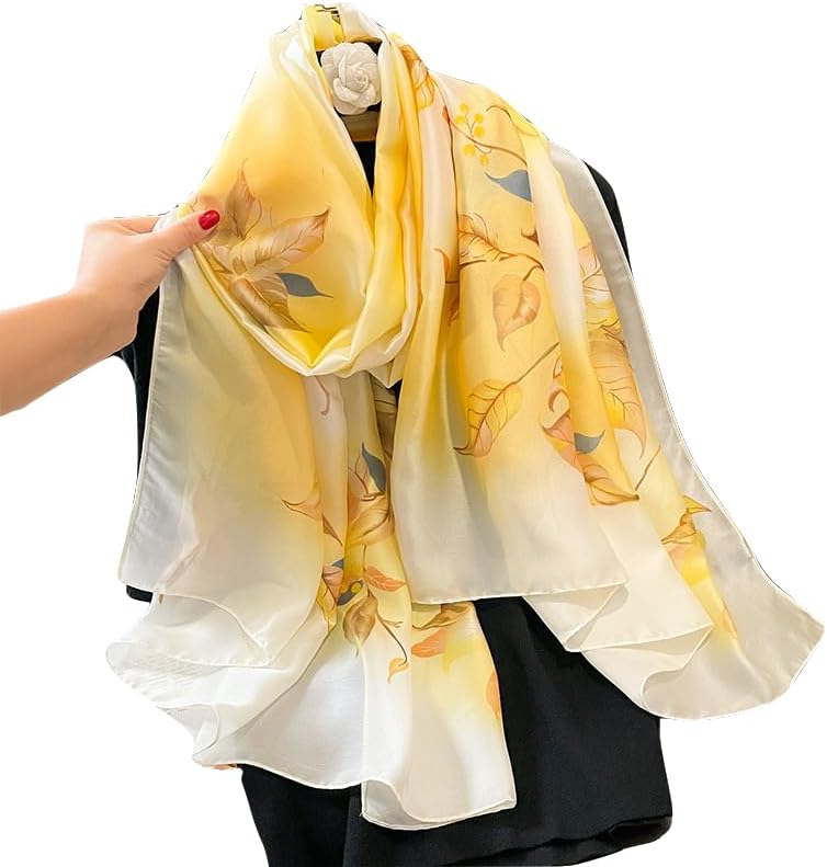 Golden yellow and cream silk-satin scarf featuring a delicate autumn leaf botanical pattern