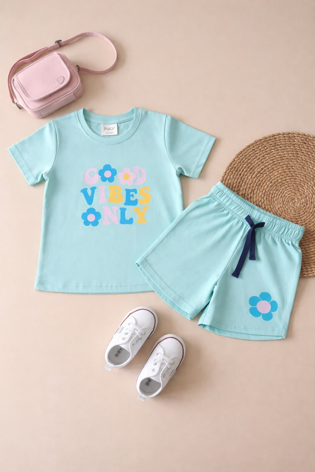 Girls mint green summer outfit set with “Good Vibes Only” t-shirt and matching shorts